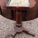 Old and large round winegrower's table made of wood.