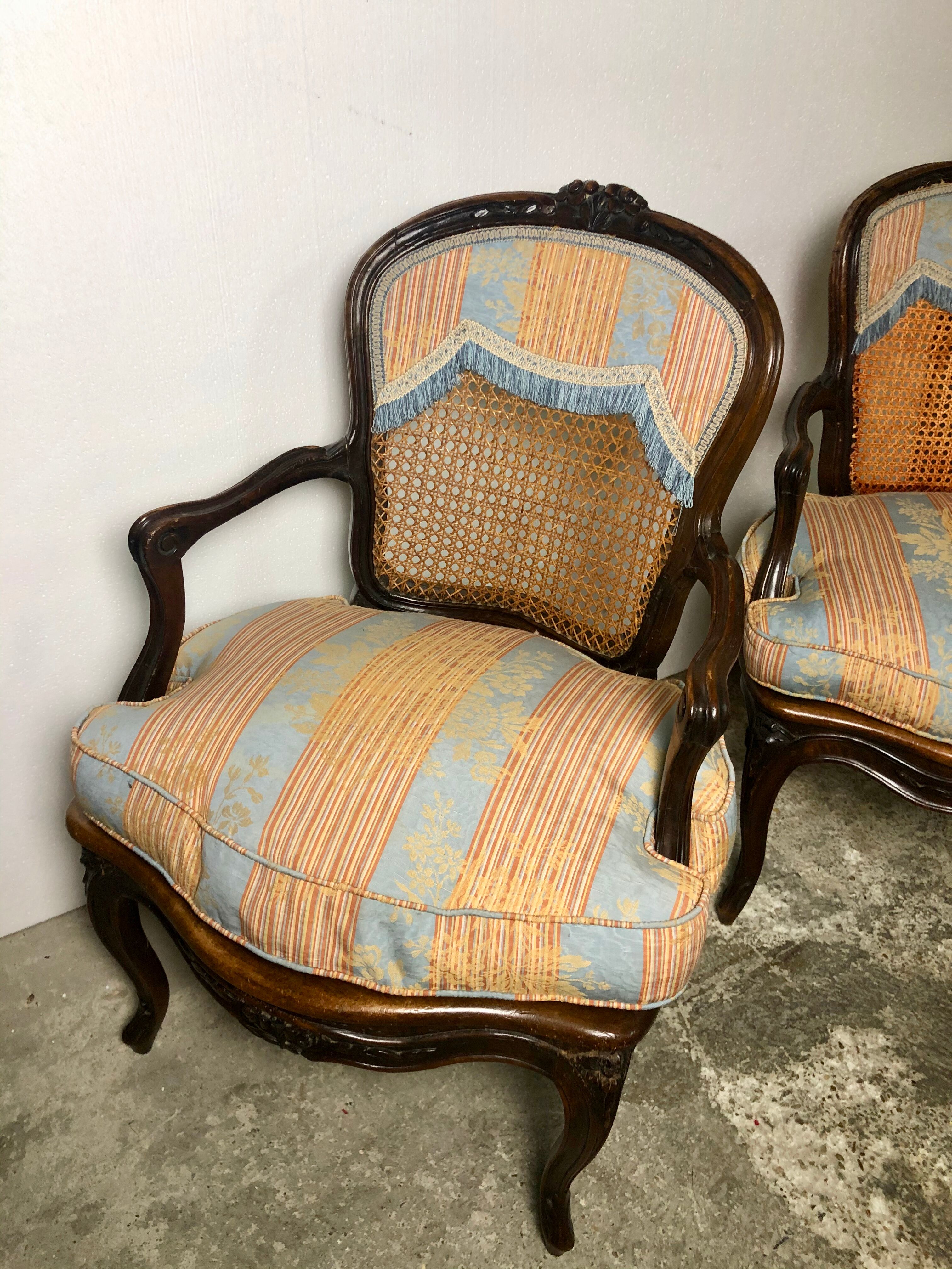 Convertible armchairs Louis XV era in walnut moulded and cannes
