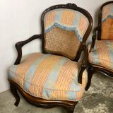 Convertible armchairs Louis XV era in walnut moulded and cannes