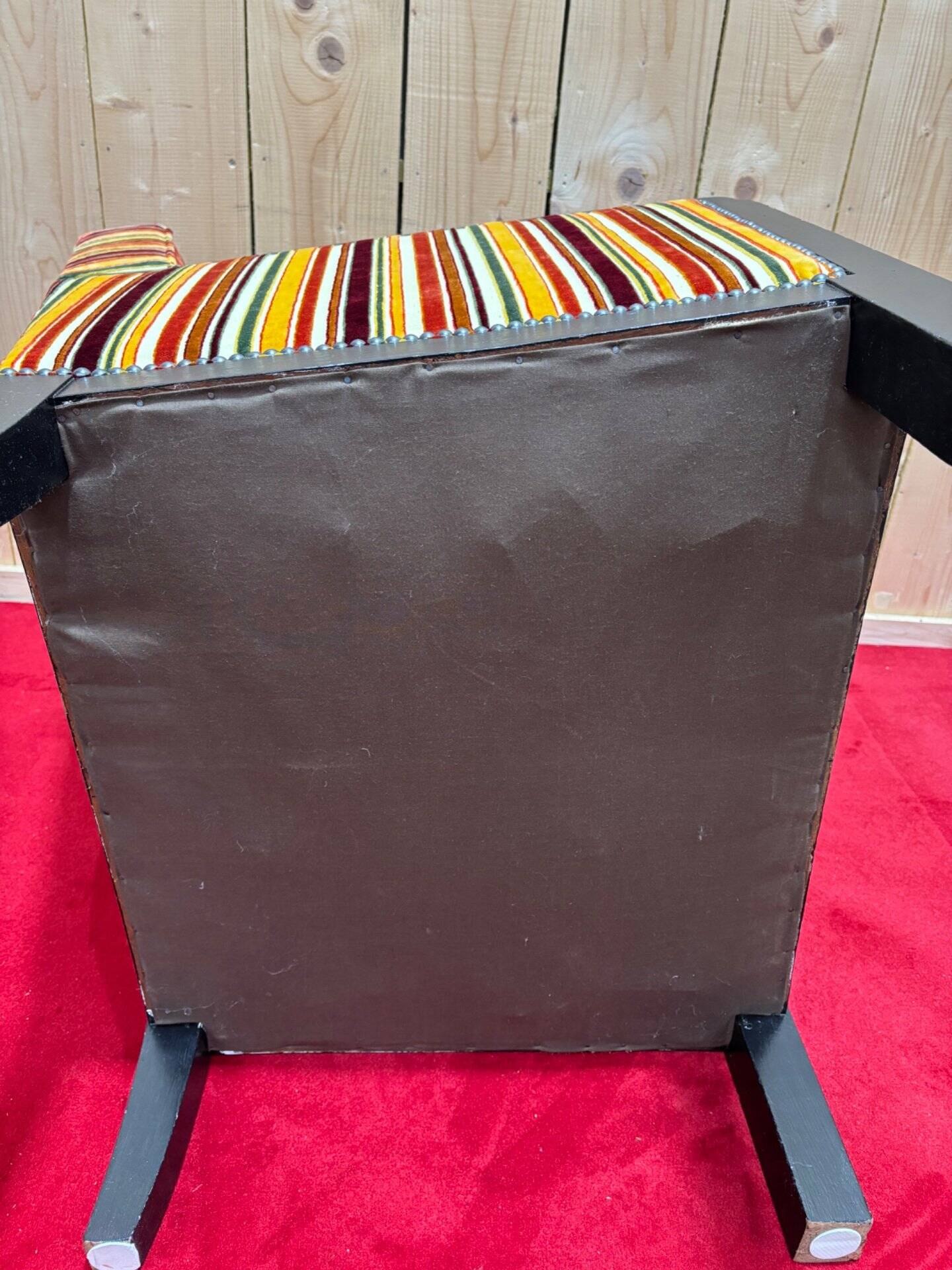 Art Deco armchair in multicolored striped fabric and its footrest