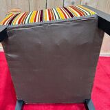 Art Deco armchair in multicolored striped fabric and its footrest