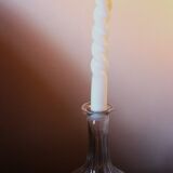 Round-bellied glass carafe with ribbed neck.