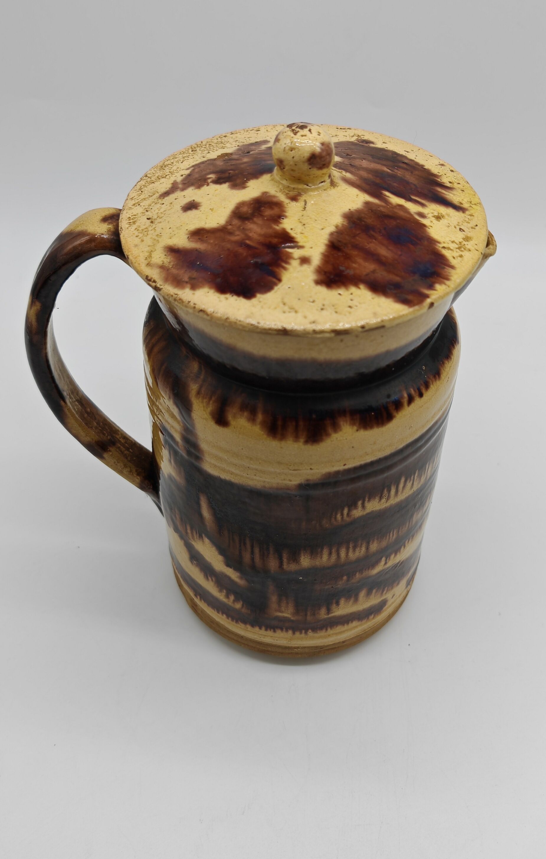 Pitcher covered in glazed earth old french tabby dishes