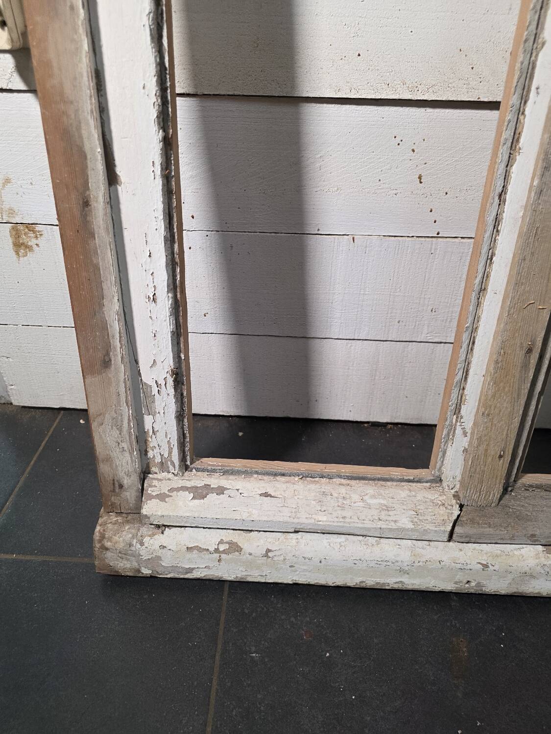 Old arched window made of fir wood