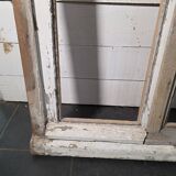 Old arched window made of fir wood