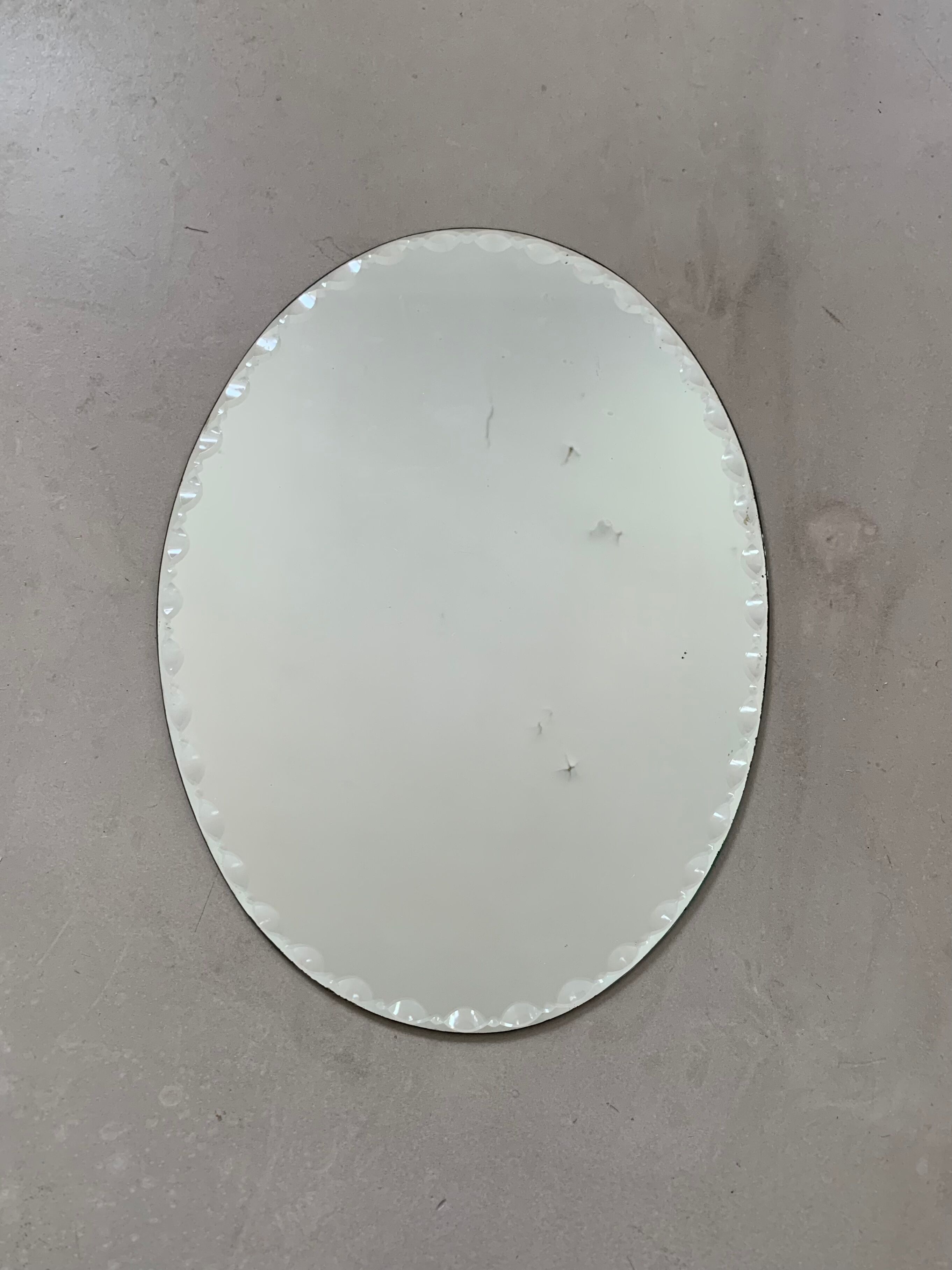 Old beveled oval mirror