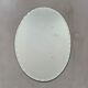 Old beveled oval mirror