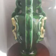 Earthenware vase with 3 caryatids