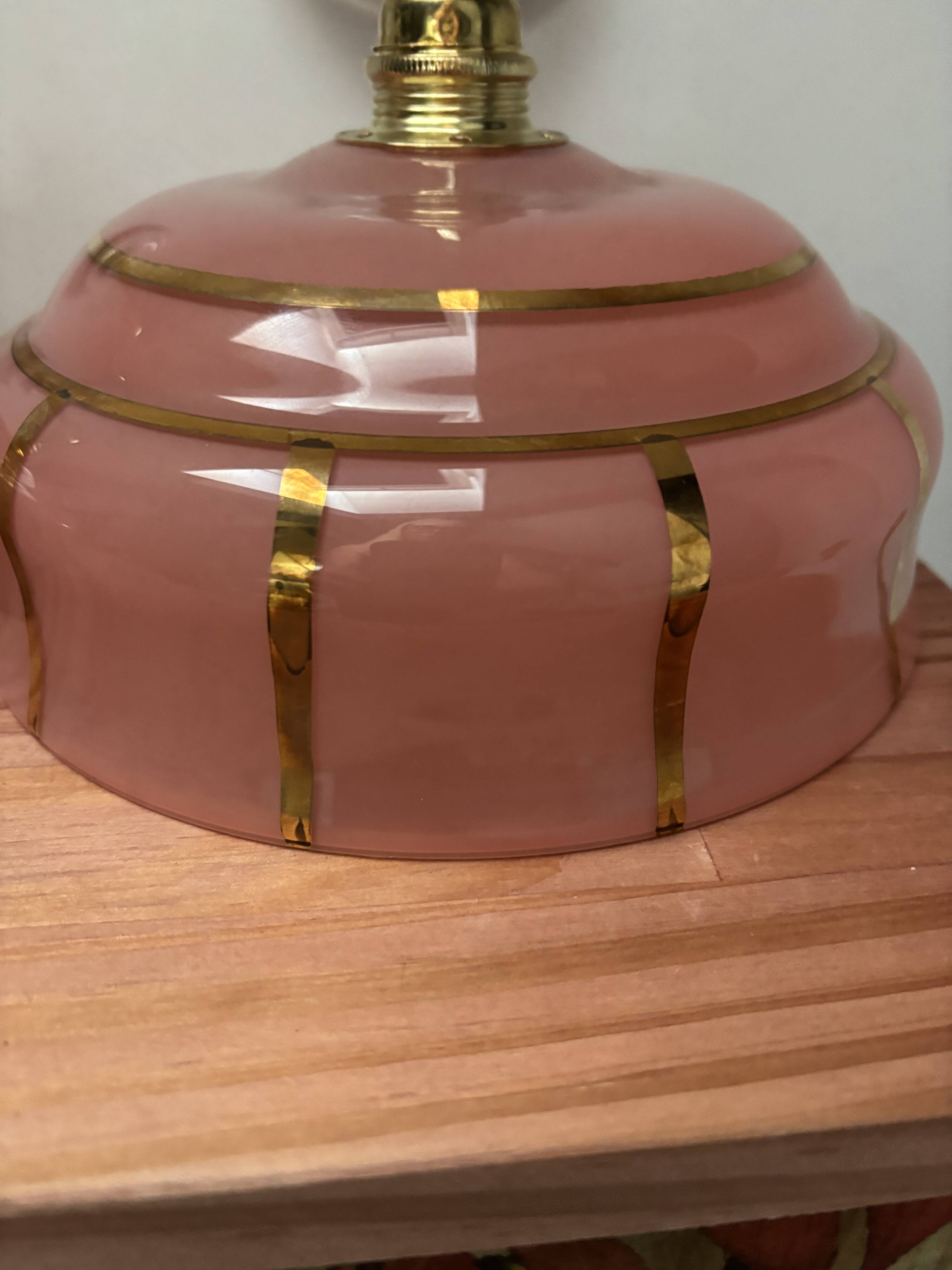 Pair of white ceramic wall lights with pink glass