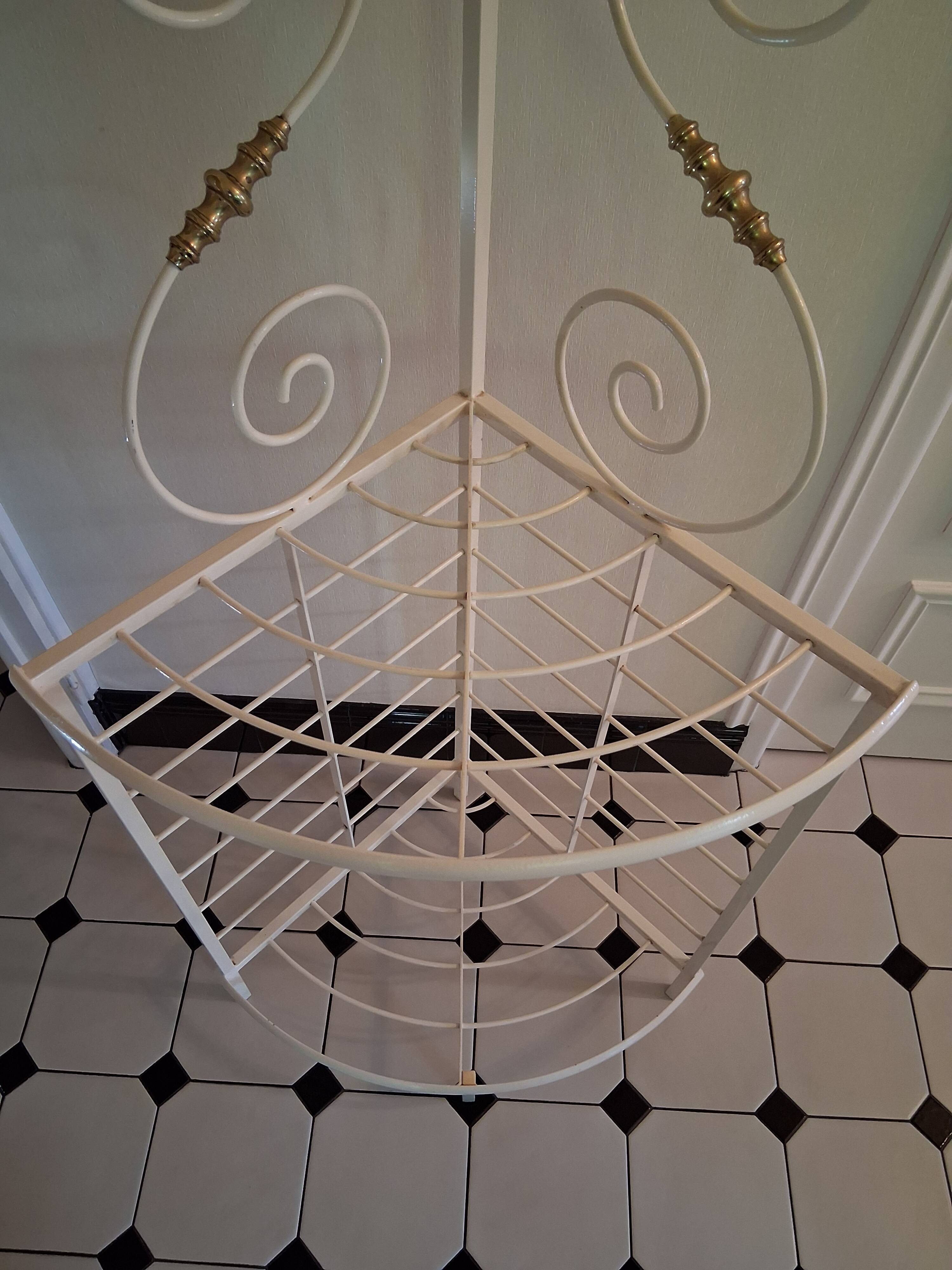 Cream and brass corner bakery shelf in wrought iron