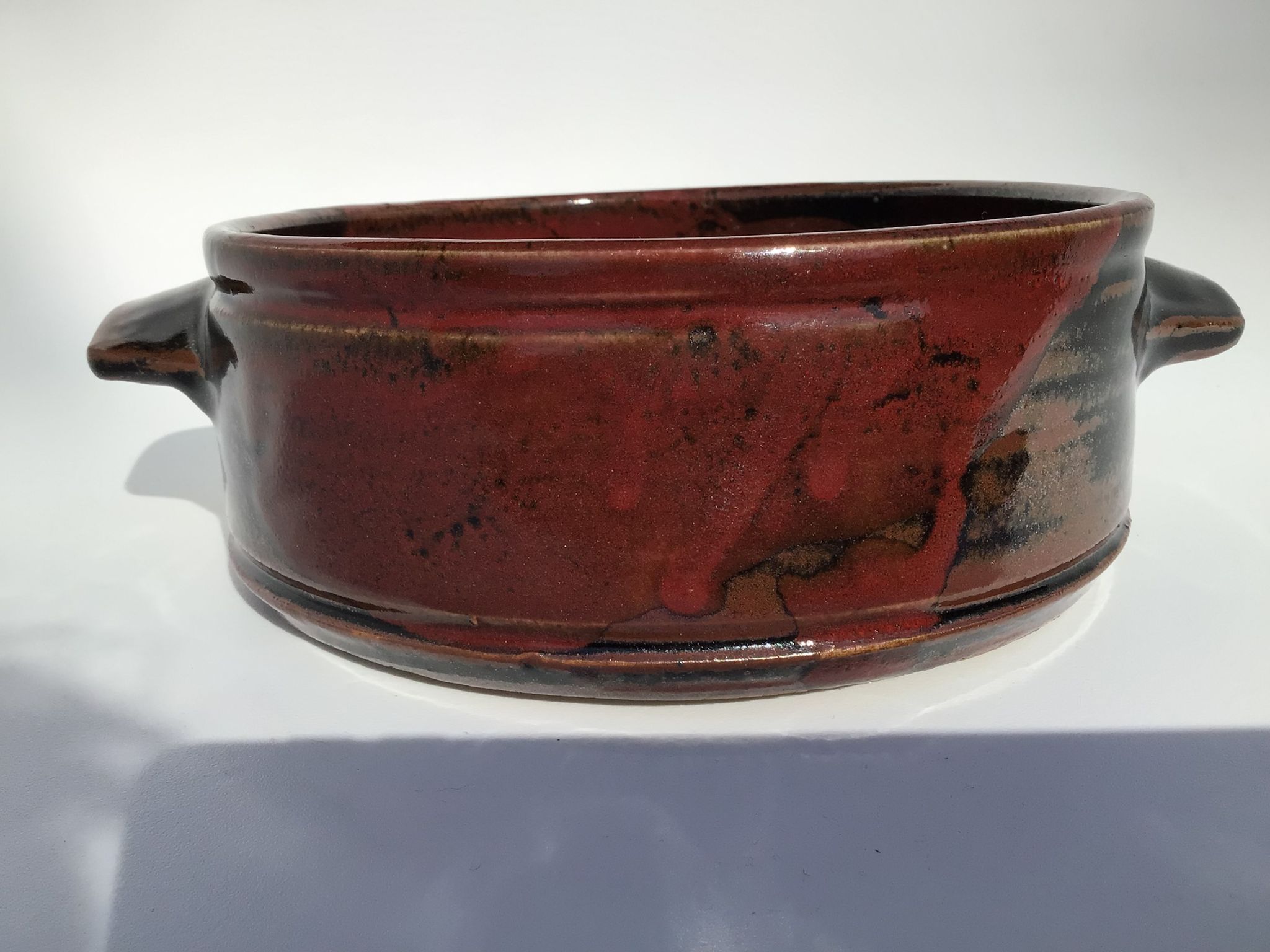 Artisanal sandstone dish signed Guibert red brown decorated