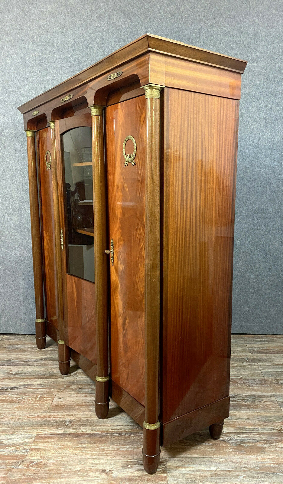 Empire library in varnished mahogany around 1950