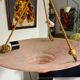 Art Deco basin suspension with pink glass and fabric cords.
