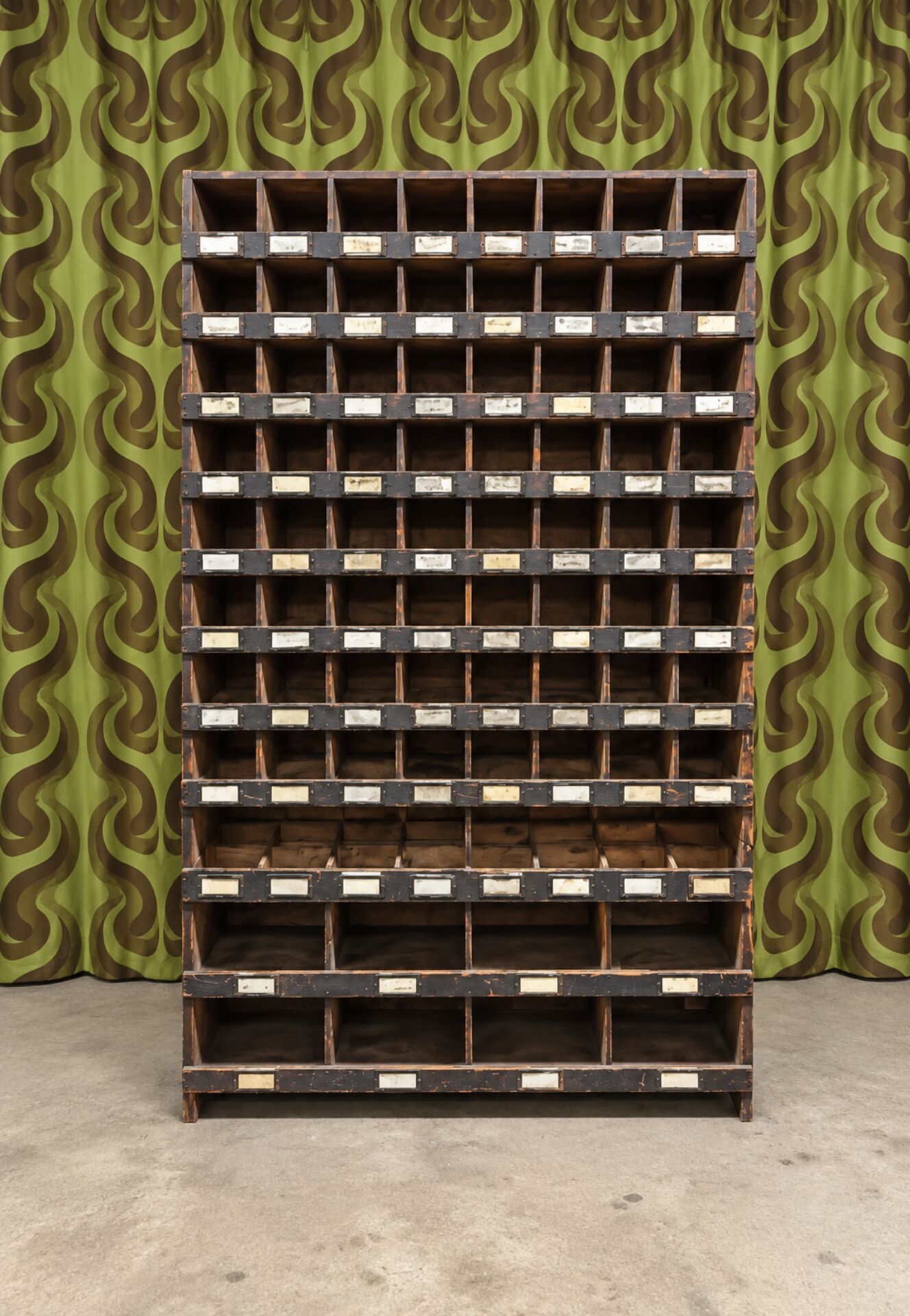 Antique workshop furniture in solid fir with numerous compartments.