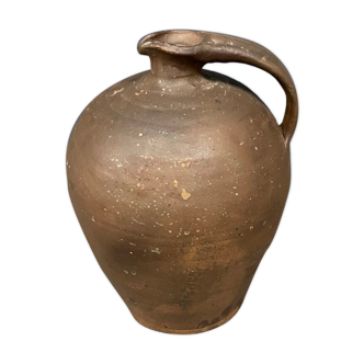 Antique jug in dark brown pottery