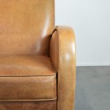 Luxury armchair made of cowhide leather with a beautiful warm colour scheme