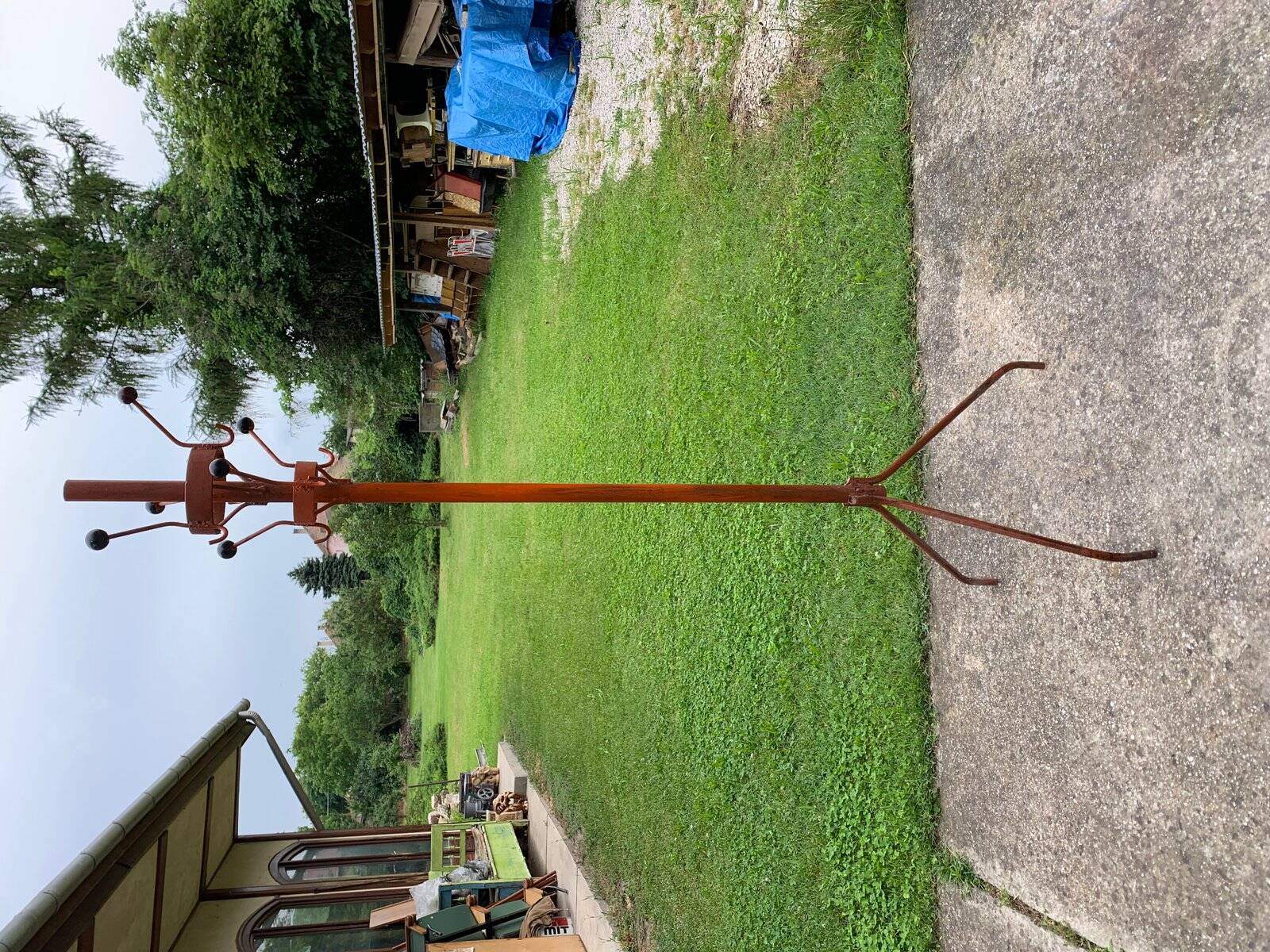 Vintage red industrial coat rack in cast iron, 1950s style, tripod base.