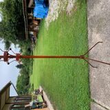 Vintage red industrial coat rack in cast iron, 1950s style, tripod base.