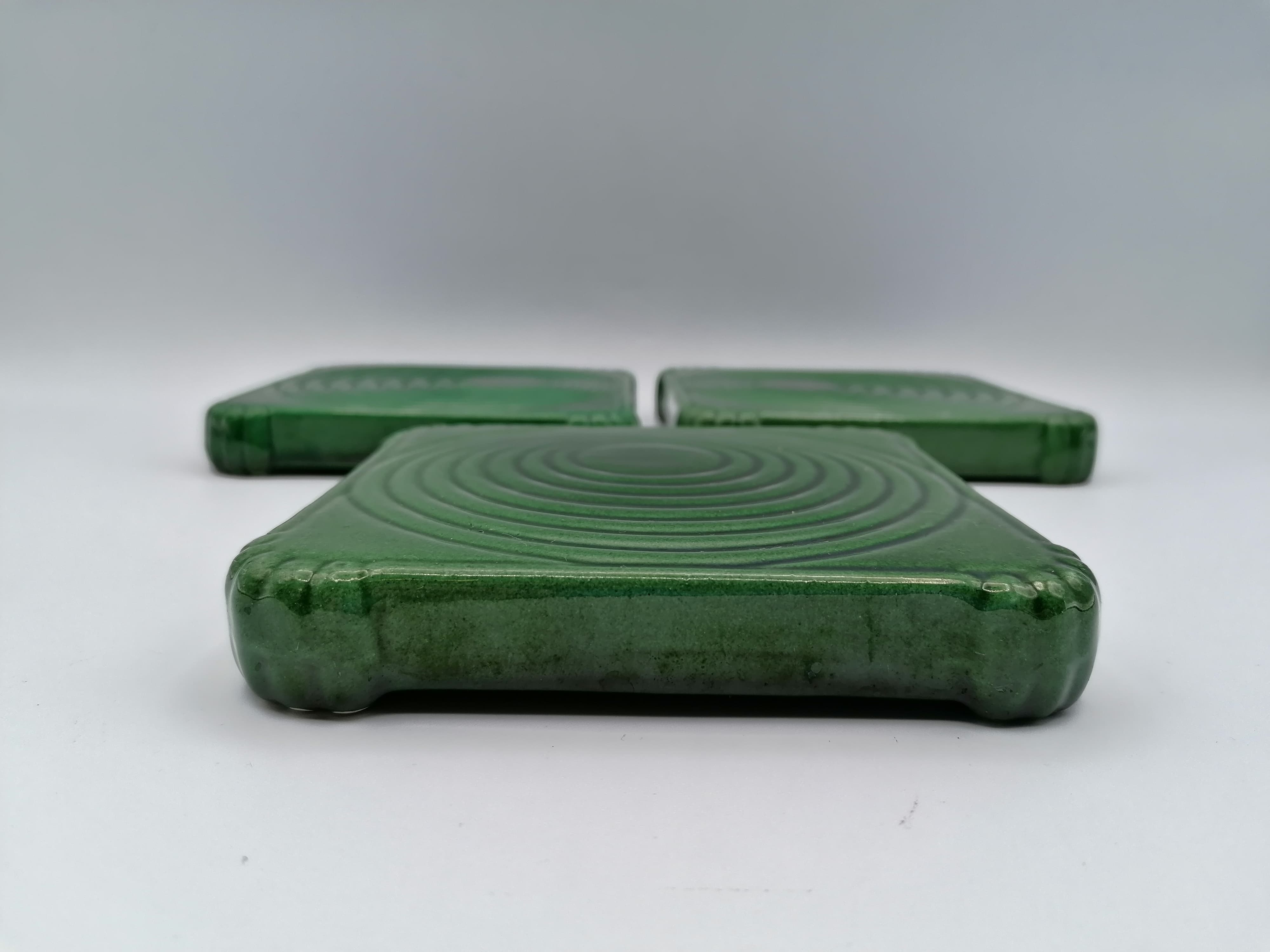 Under the plate and 3 under the bottle