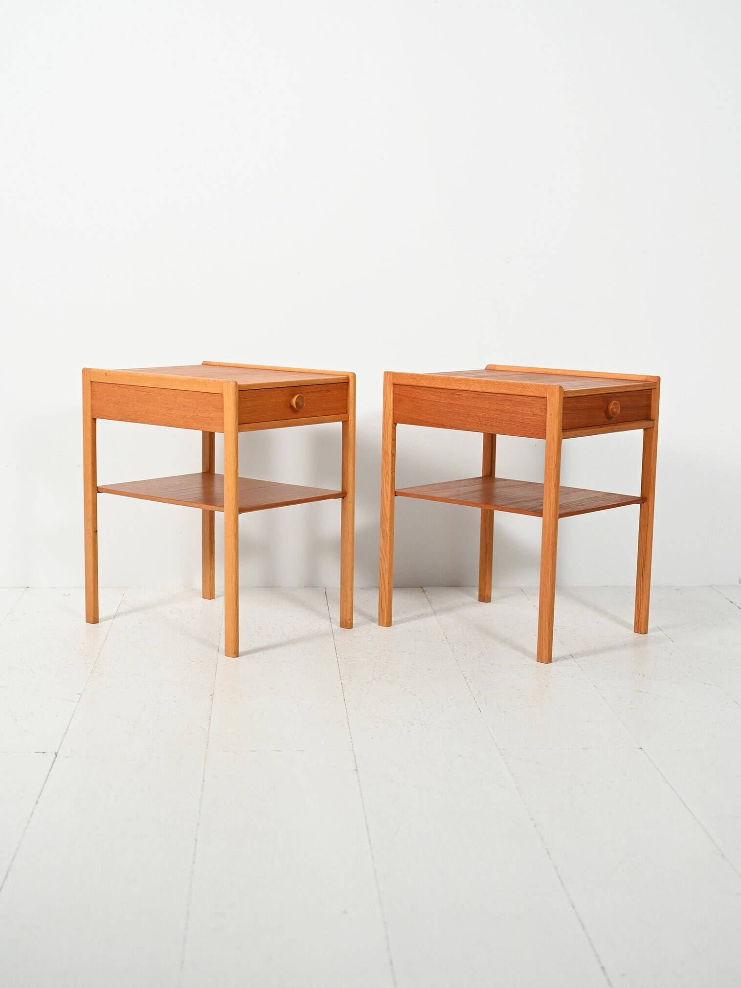 Pair of Scandinavian bedside tables from the 1950s–60s with carved handle