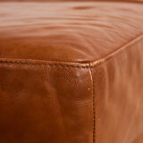 Ottoman with leather upholstery