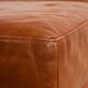 Ottoman with leather upholstery