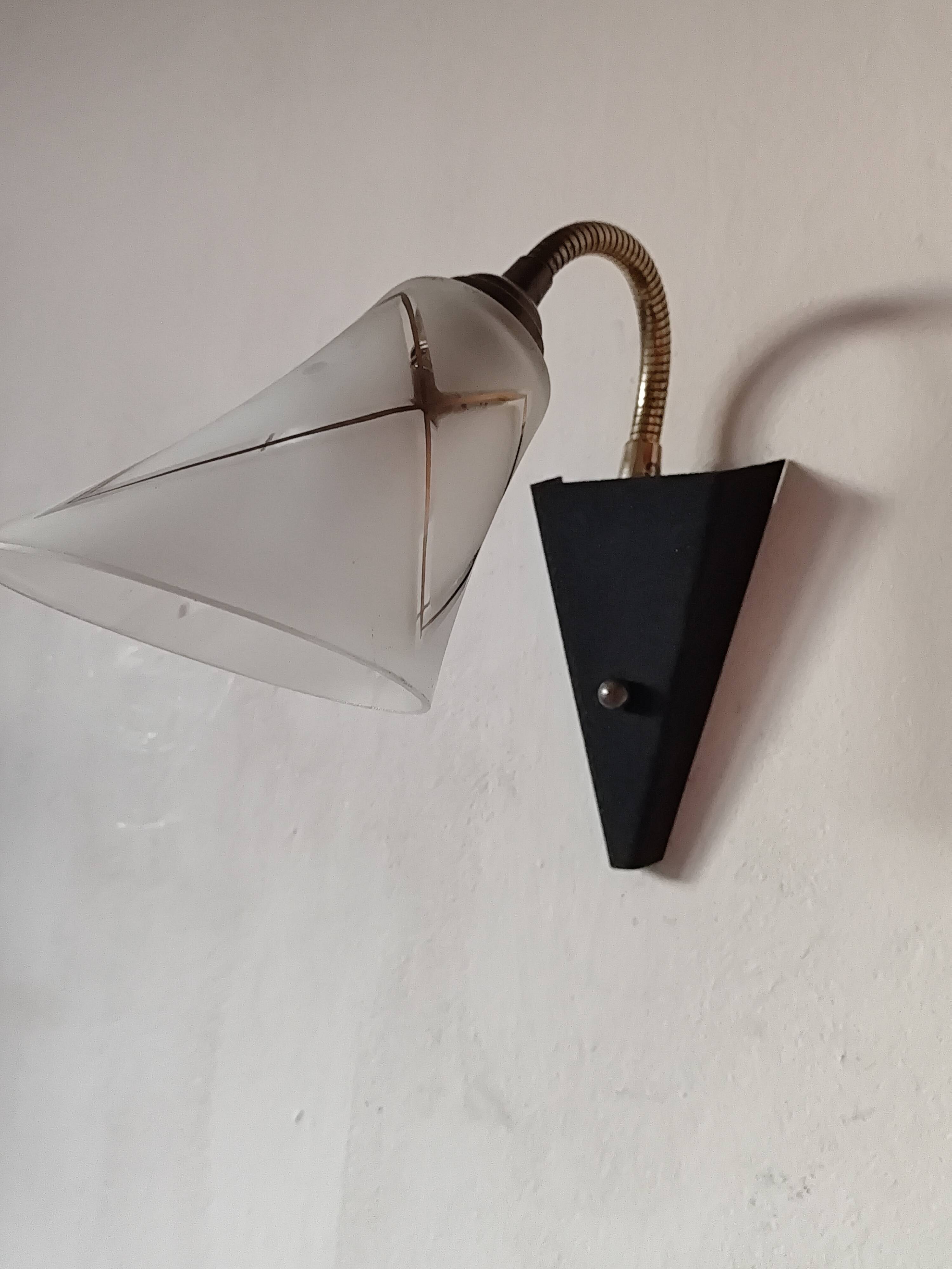 1950s wall lamp, metal, flexible brass stem and opaque shade.