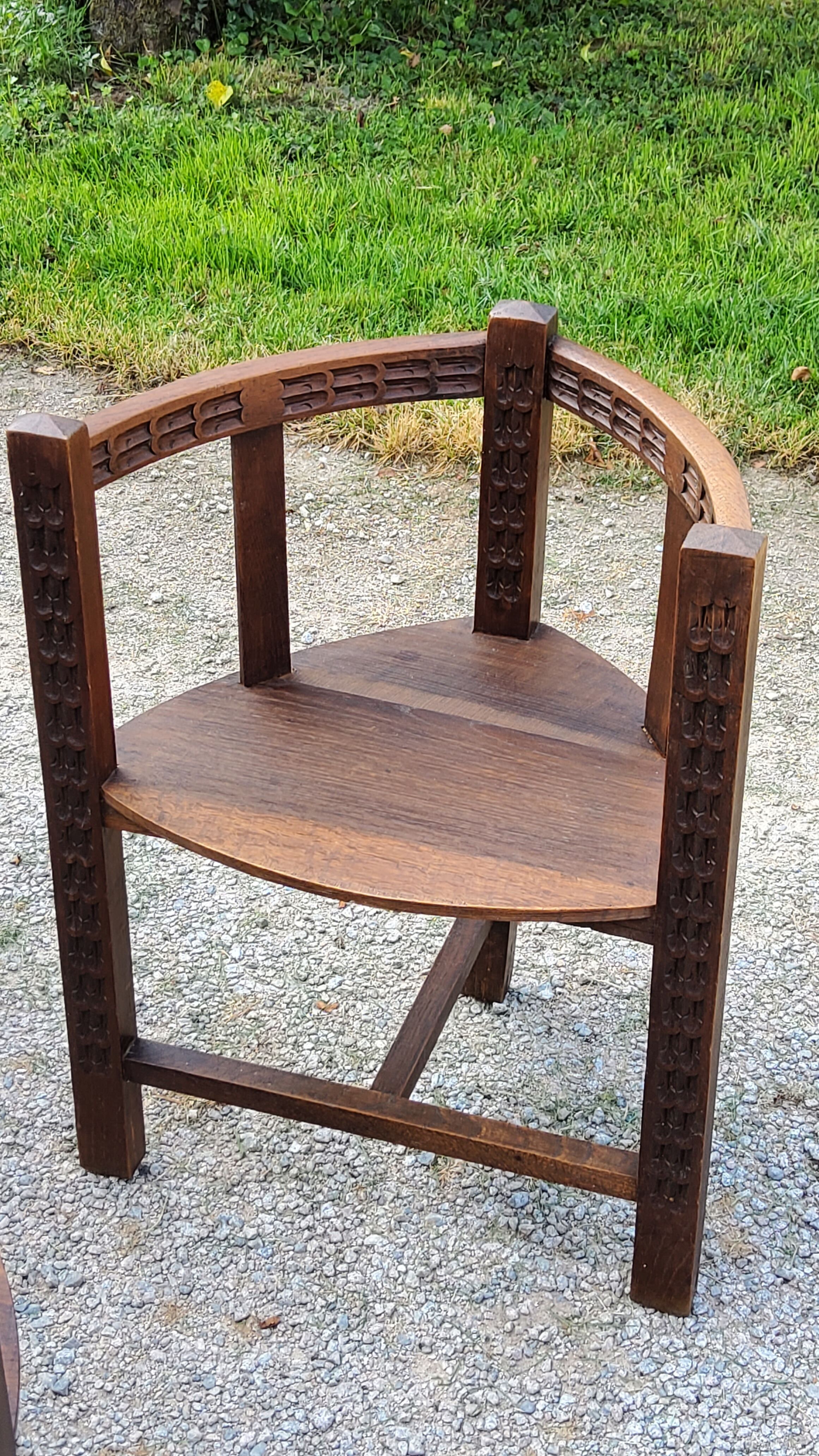 Set of three brutalist tripod armchairs in carved solid oak