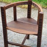 Set of three brutalist tripod armchairs in carved solid oak