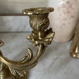 Pair of rocaille candlesticks in gilded bronze