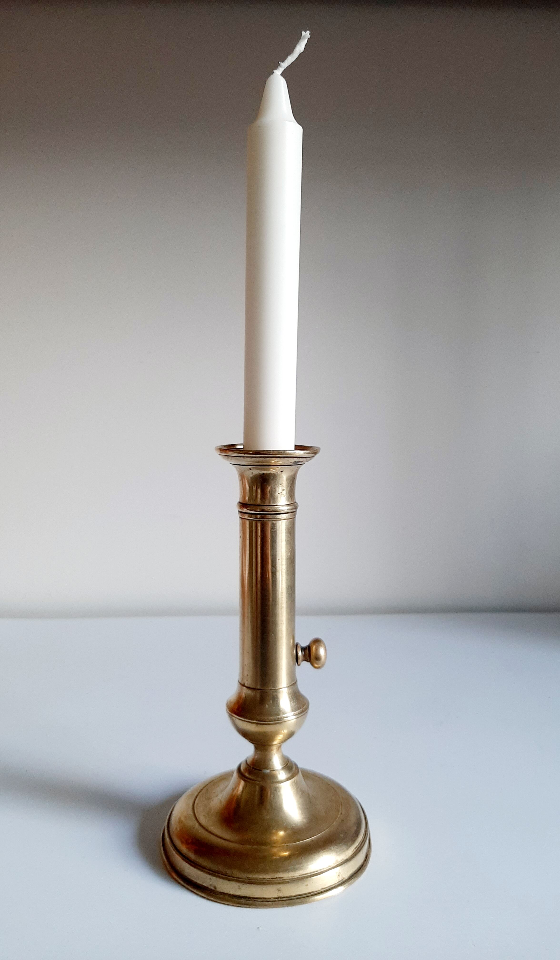 Golden brass candle holder