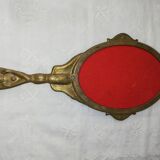 Old hand-facing mirror in gilded bronze