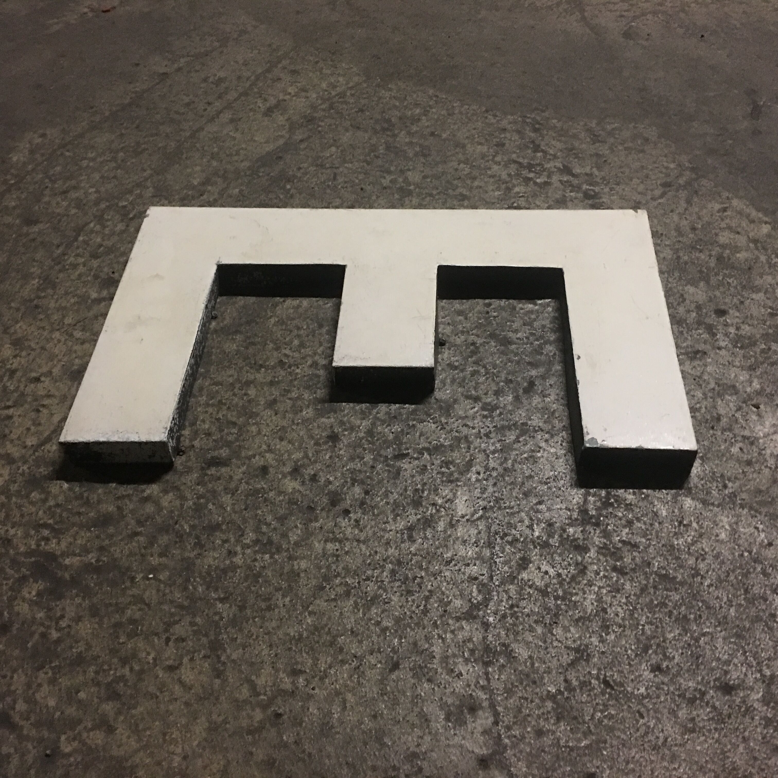 Letter e in old zinc