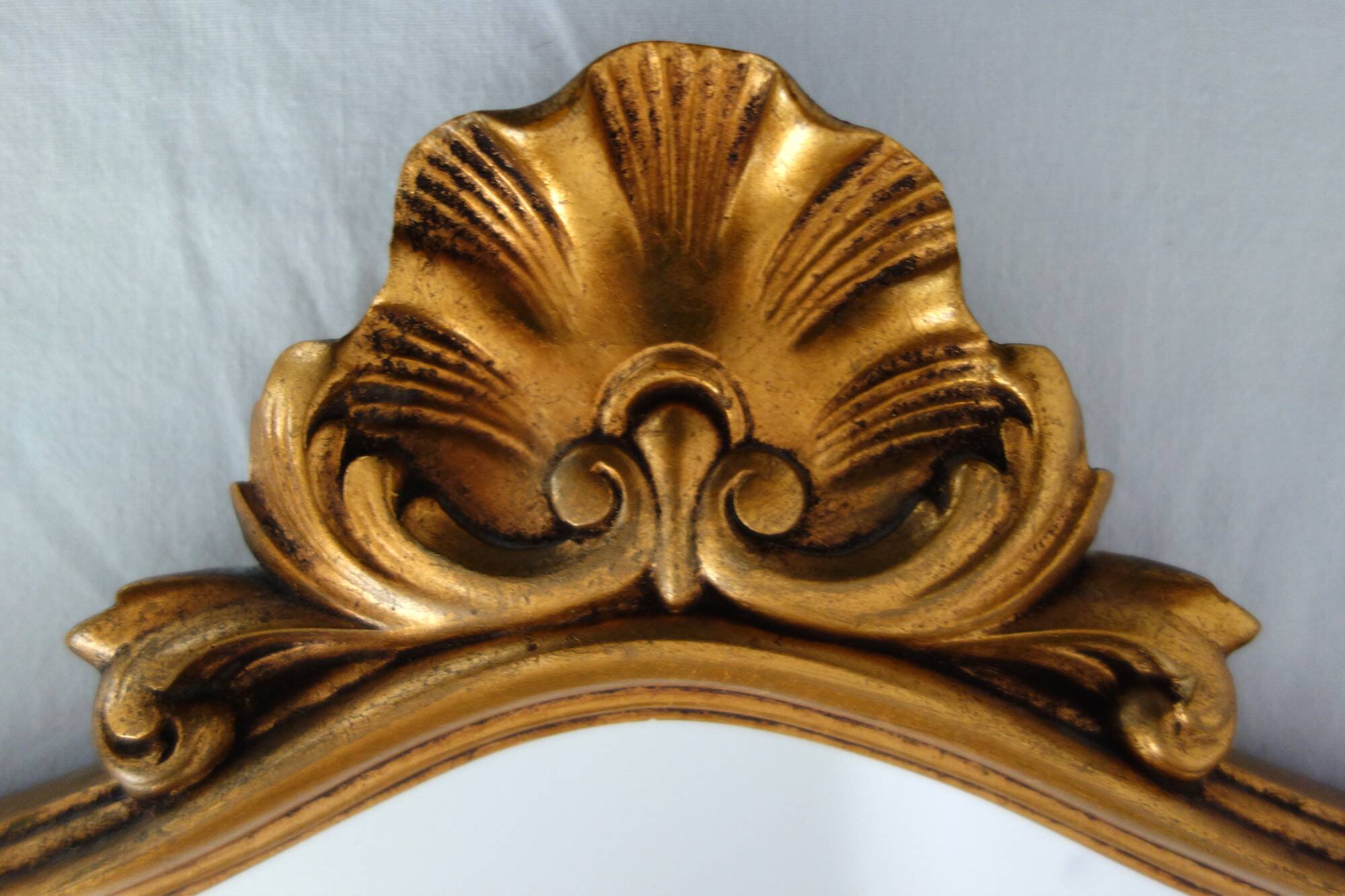 Vintage rocaille or shell gold mirror