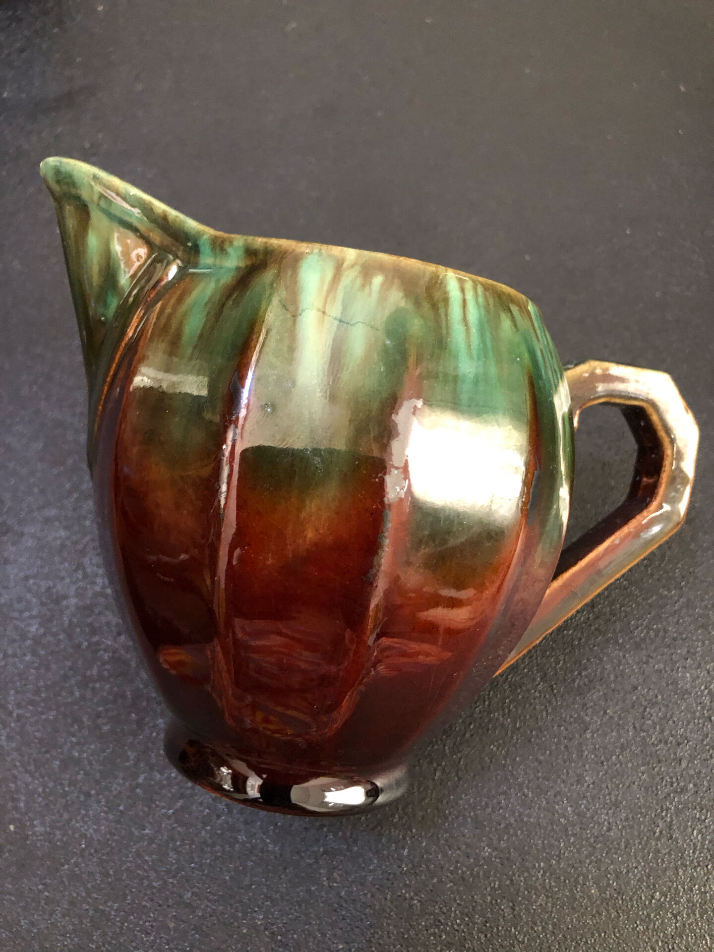 Large service in green and brown glazed stoneware with facets, signed Louis Cag.