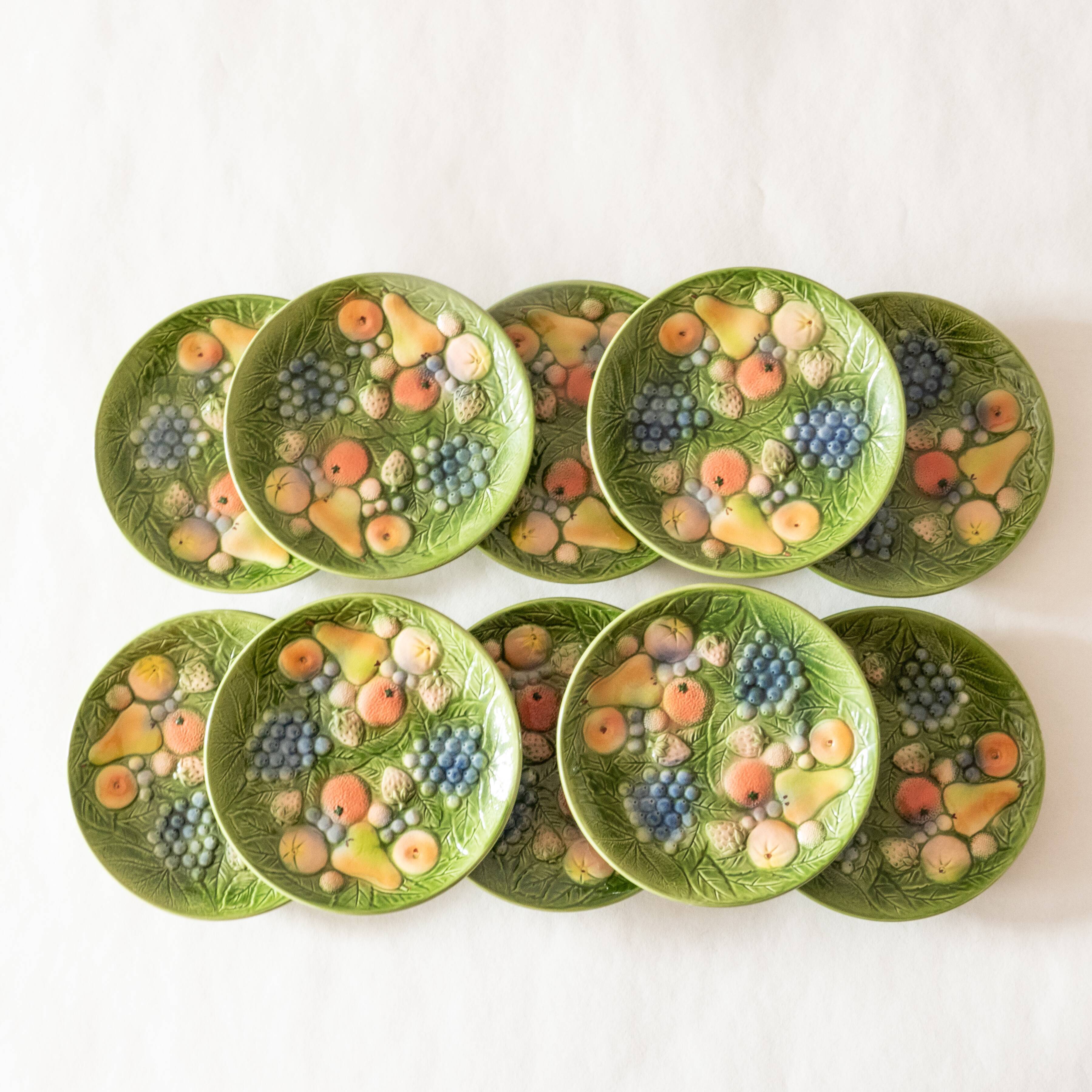 10 antique plates in fruit slip