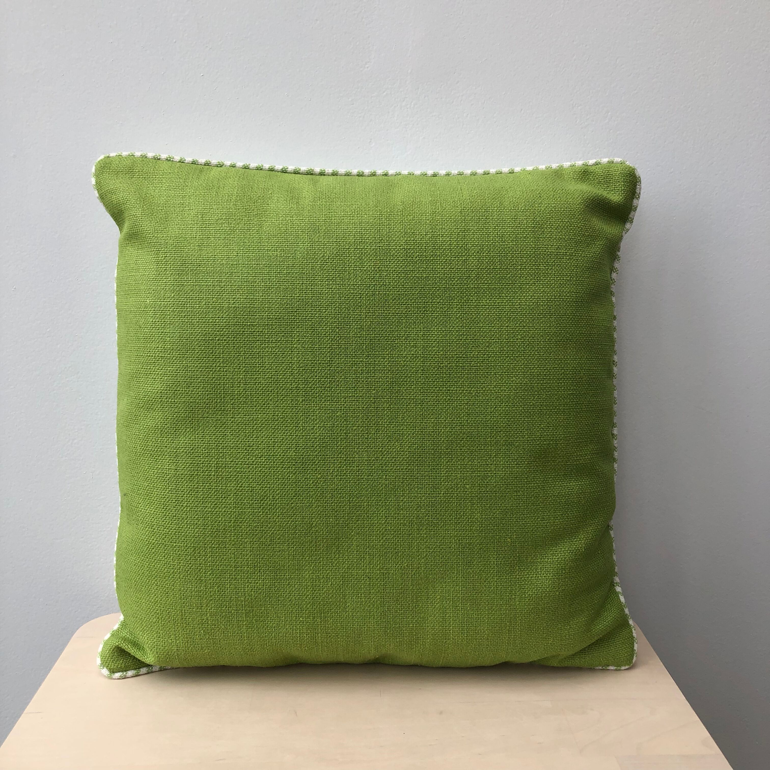 Green and white striped cushion