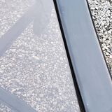 70s design coffee table in black lacquered wood with smoked glass top