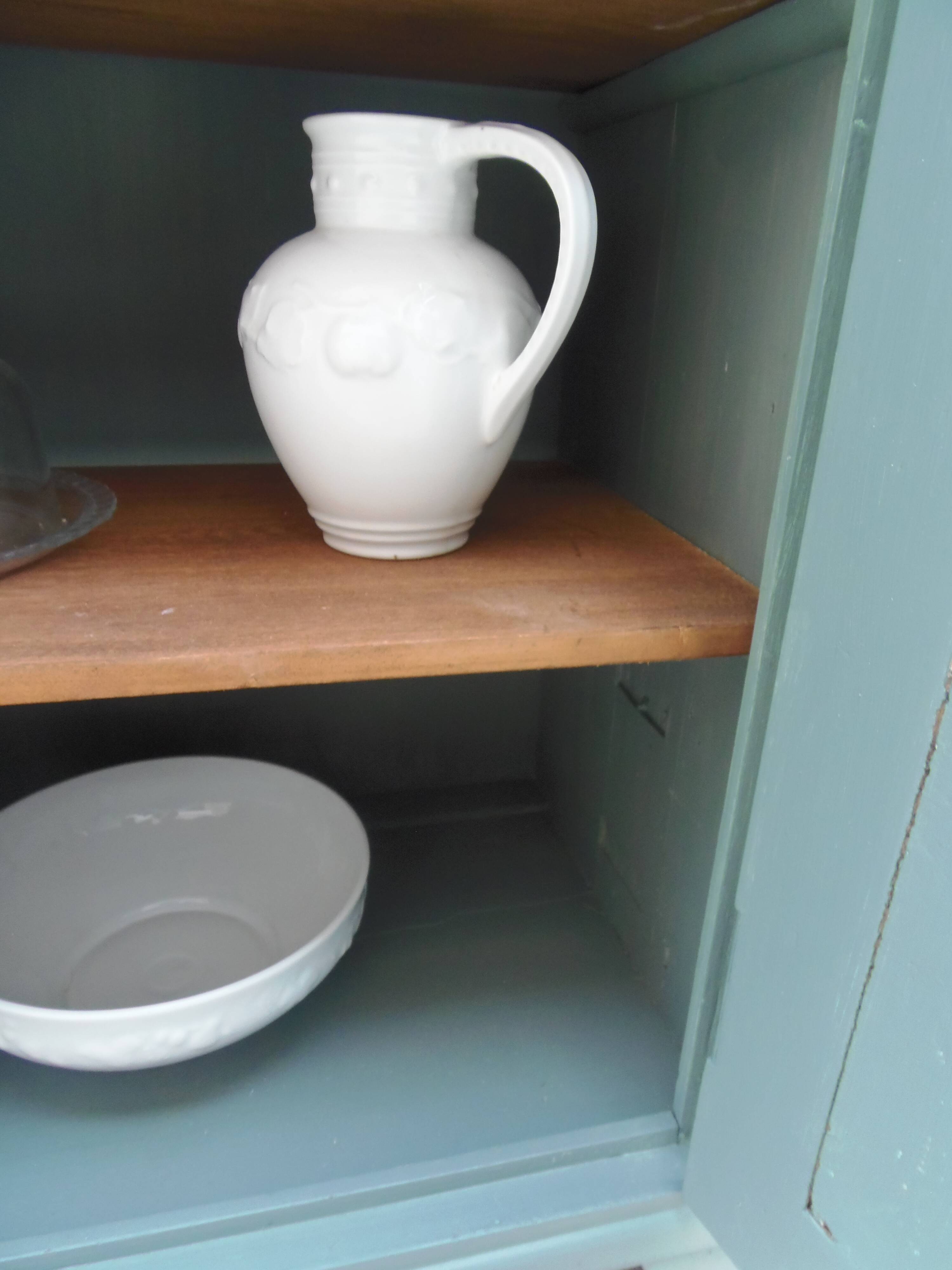 Vintage jam jar enhanced in smoky green, wooden tray.