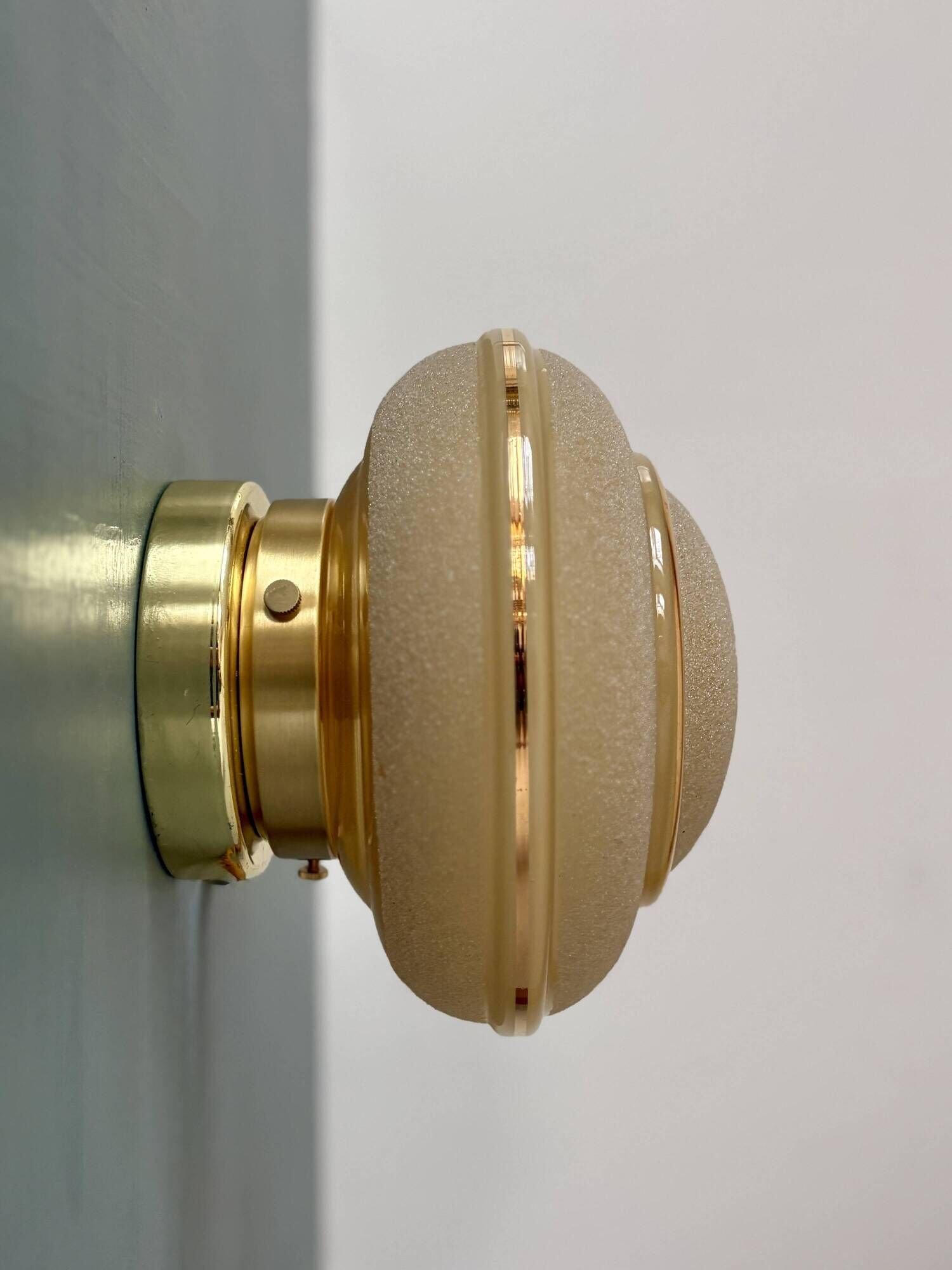 Vintage Art Deco globe wall/ceiling light in frosted yellow and gold glass.