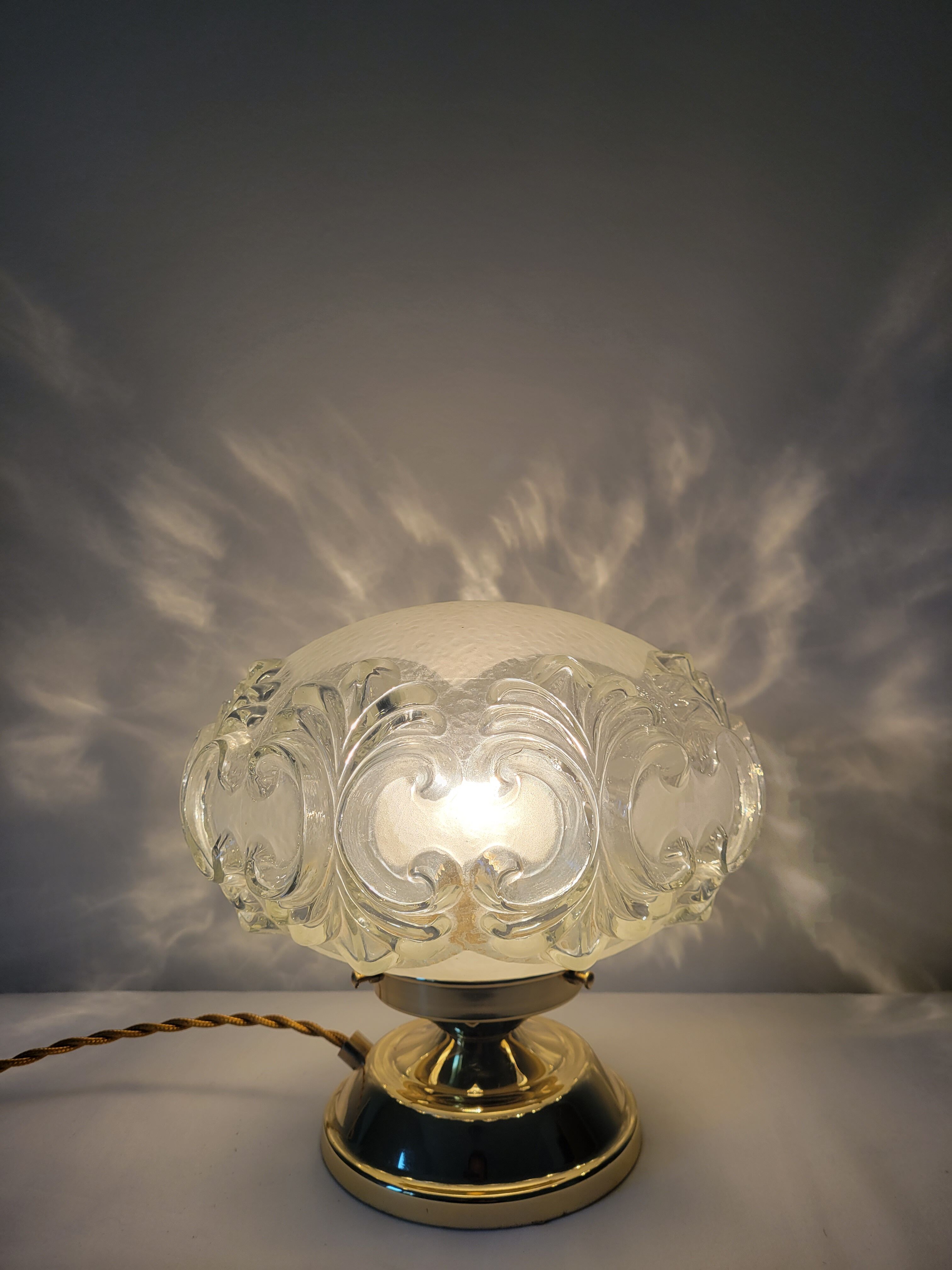 Brass lamp with molded glass globe