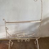 Old wrought iron cradle painted