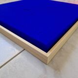 Framed monochrome blue abstract painting.