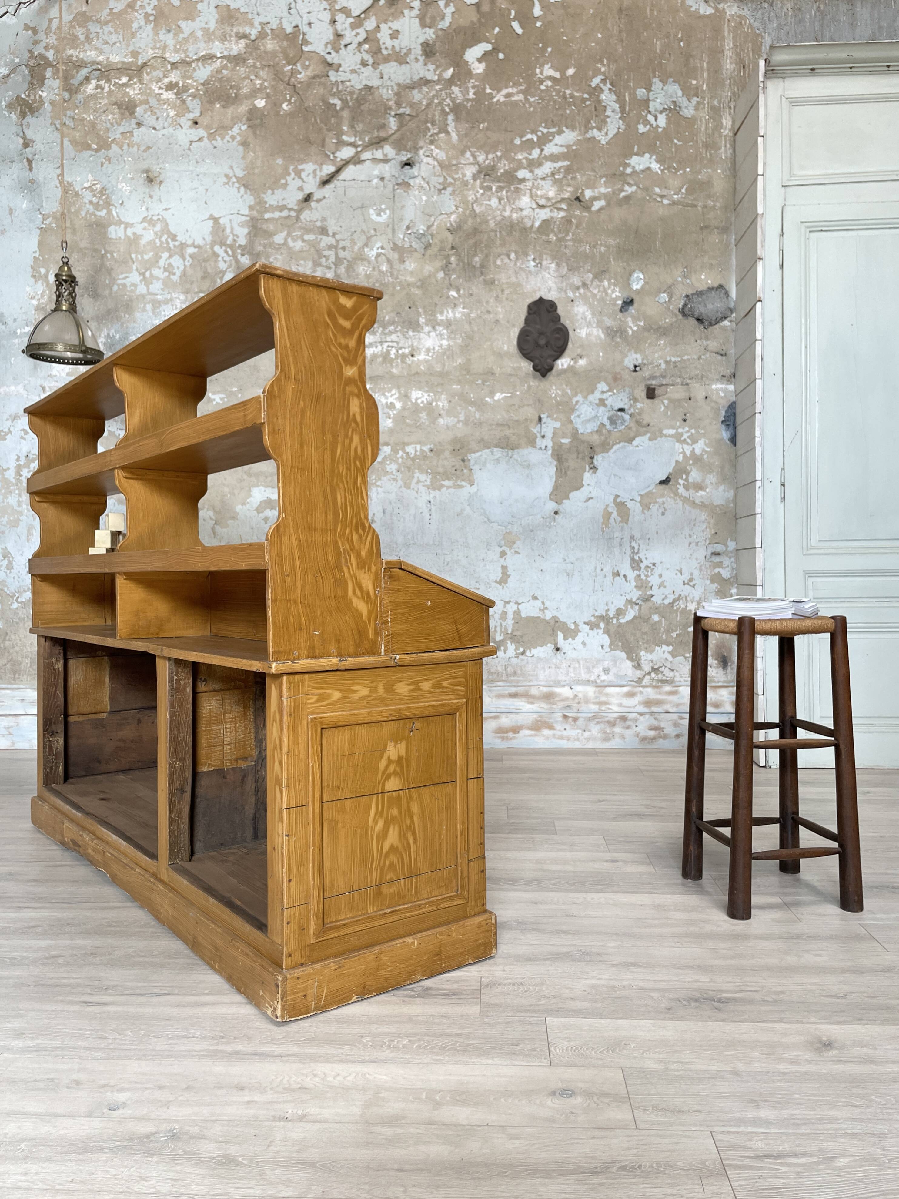 Wooden hardware cabinet painted with wood effect, circa 1940.