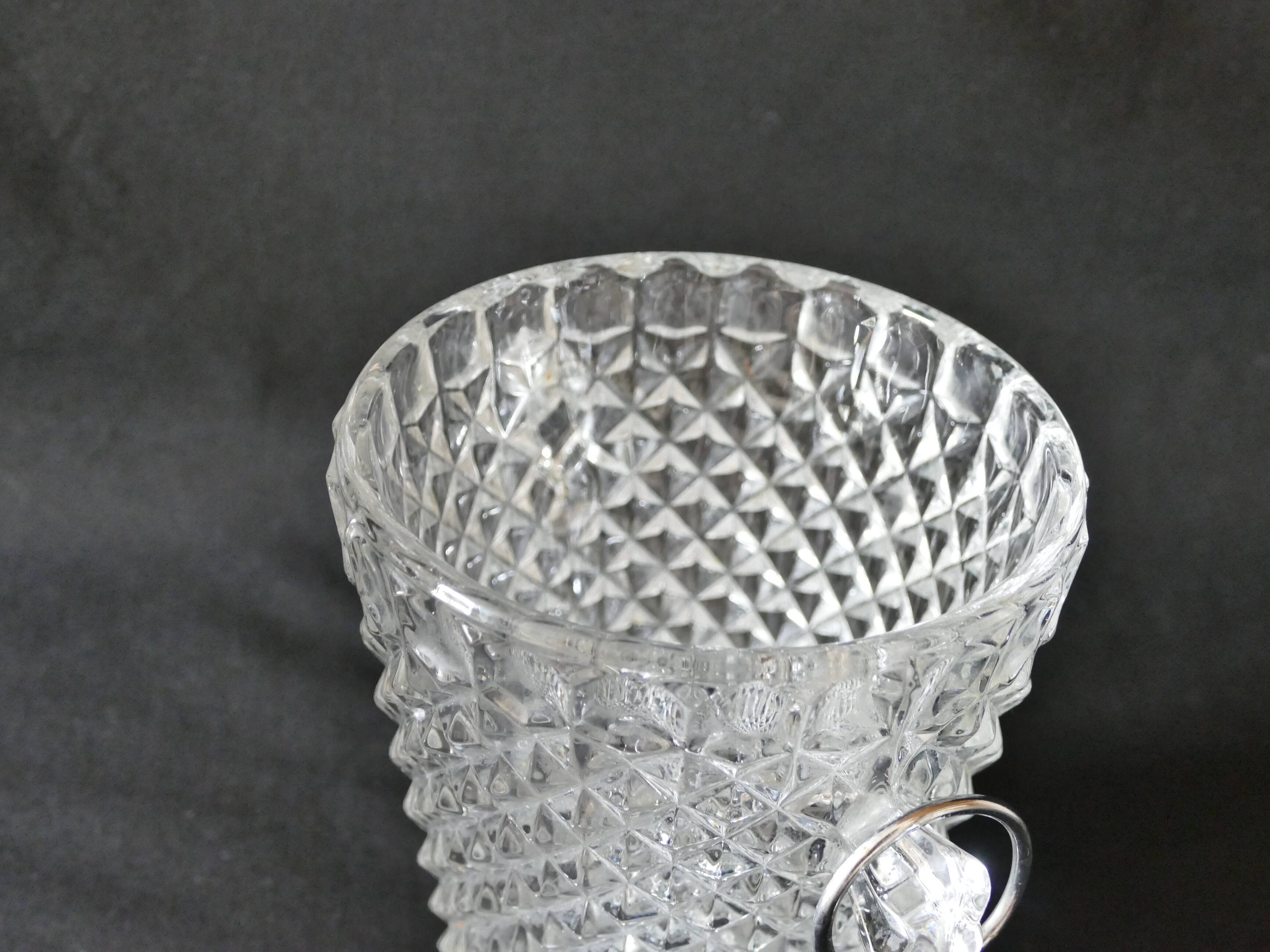 Vintage glass ice bucket stamped with a metal handle