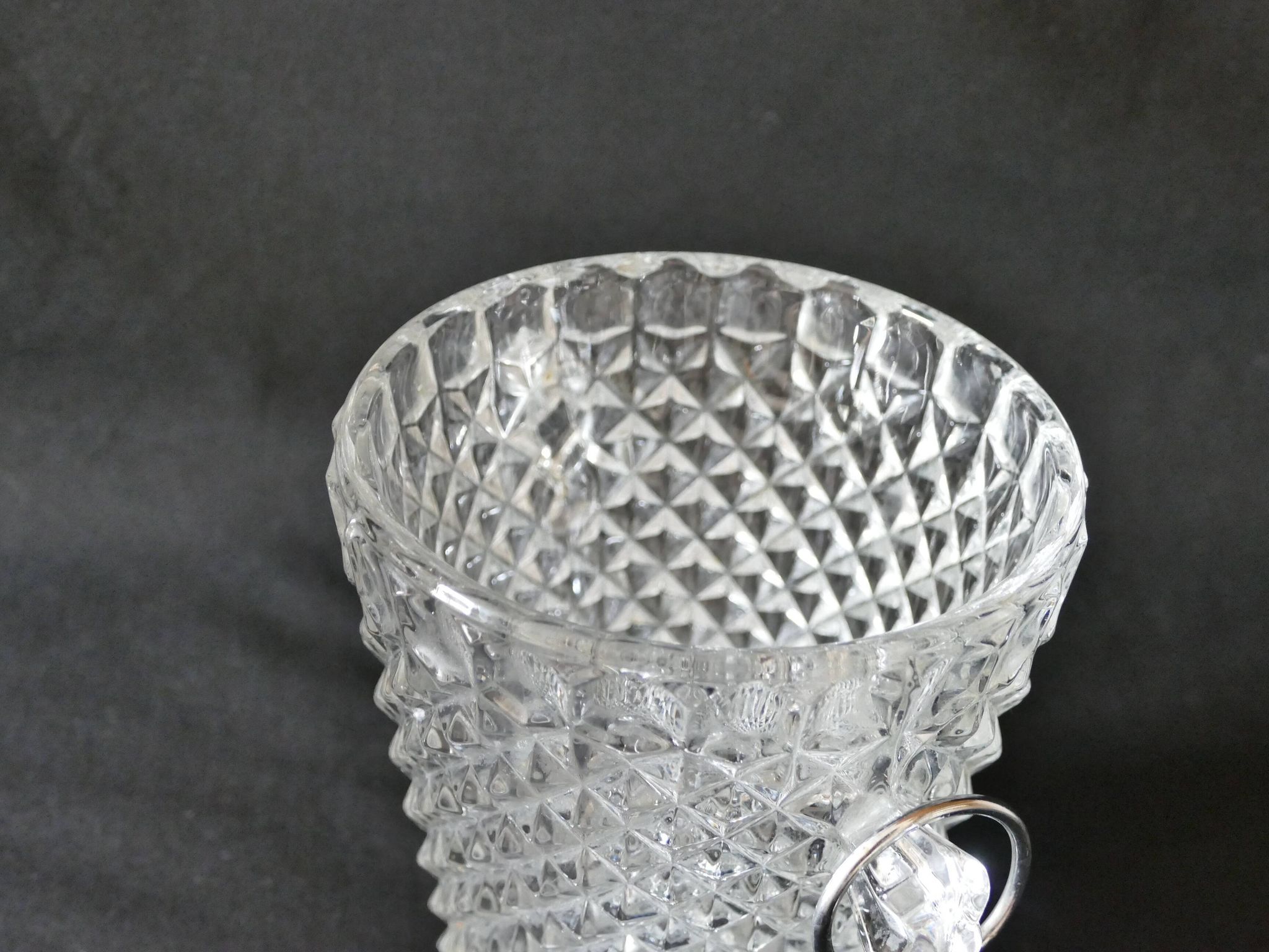 Vintage glass ice bucket stamped with a metal handle