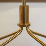 Free-standing shelf in gilded brass with smoked glass shelves. 1970s.