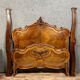 Center bed Louis XV rocaille of curved shape in walnut