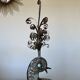 metal sculpture in sheet metal representing a peacock, work from the 1960s