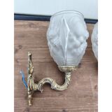 Pair of brass wall lights and glass paste.